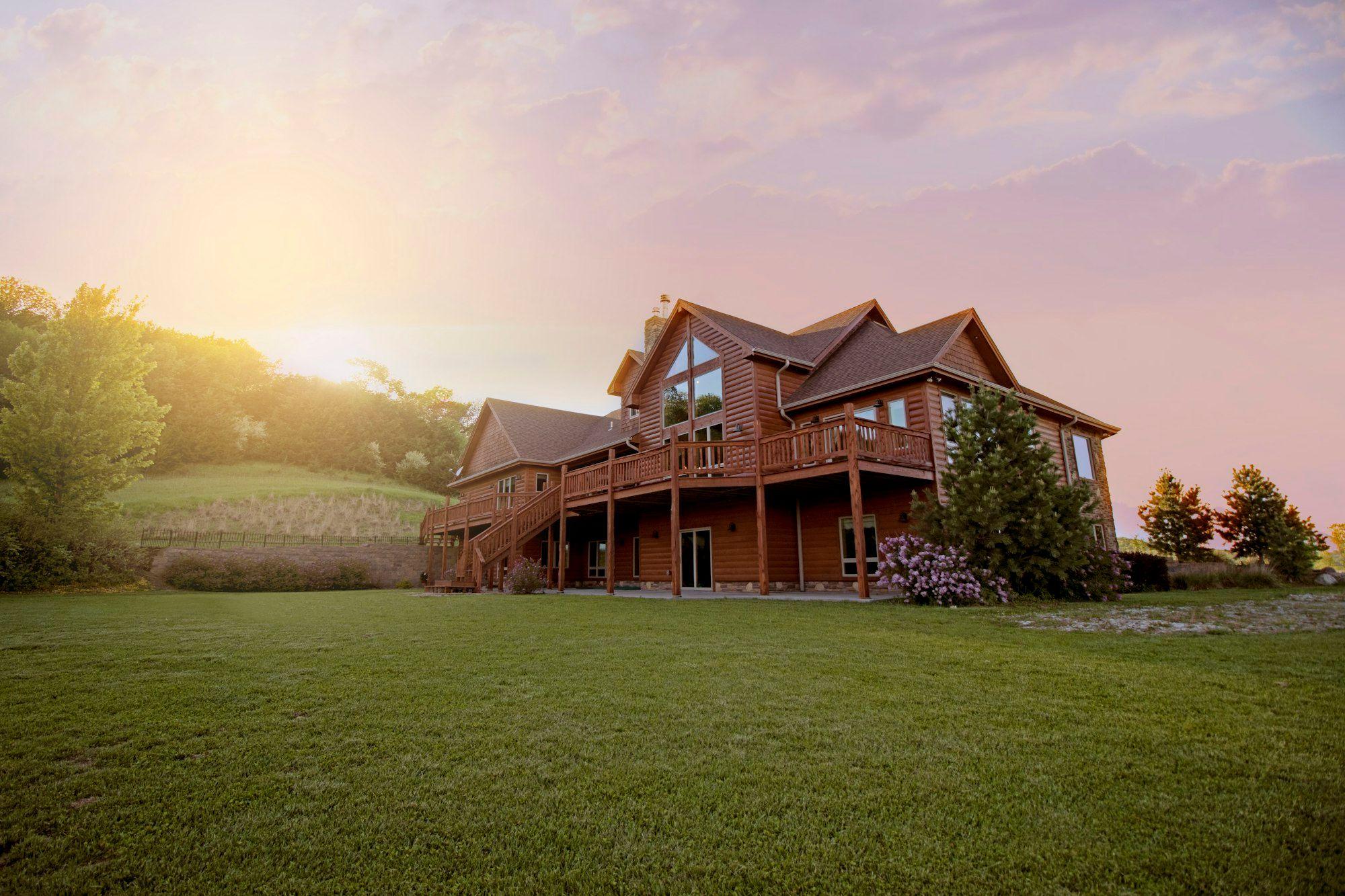 Wood home on open land in Goochland at sunset